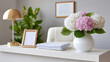 ©  VladaToday - Clinic reception desk with vase of hydrangea flowers and framed certificate for calm healthcare counter background and office design