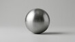 © Subagio - A single scratched metallic chrome ball with realistic reflections and surface texture on a neutral gray background.
