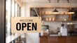 © artifexgenz - Wooden open sign with bold black text hanging on a glass door in a shop