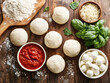 © Liliya - Fresh pizza dough balls, mozzarella cheese, tomato sauce, grated cheese, basil leaves, and flour on rustic wooden table. Italian ingredients for homemade pizza preparation.