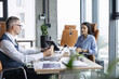 © be free - Cooperation and teamwork. Businesspeople discuss statistics and financial report. Office worker business colleague at office workplace for teamwork. Project planning. Business colleague in office