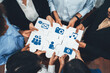 © InfiniteFlow - Diverse corporate officer workers collaborate in office, connecting puzzle pieces to represent partnership and teamwork. Unity and synergy in business concept by merging jigsaw puzzle. Concord Amity