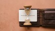 © Arafat Design Lab - Hourglass and credit card with pause before purchase text