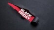 © JOLY - Black friday text revealed through a jagged diagonal tear in black paper showing a vibrant red background, for a dramatic, retail shopping concept