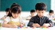 © Nai - Children play with colored shapes in a classroom during a learning activity in the day