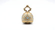 © Jevai - 3D render of a cute miniature brass bell with intricate blue and gold enamel detailing, isolated on white background