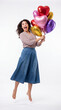 © ENDRY - Woman jumps with heart balloons.