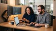 © The Subekti - Diverse software developers smiling while collaborating on a laptop