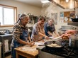 © Fadli - Group of indigenous women preparing traditional frybread together in a rustic community kitchen