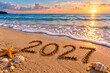 © Md.  Al-Amin - 2020 year written in sand on beach at sunset