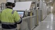 © AlAfiq - Worker in Industrial Factory Using Tablet to Monitor Machinery