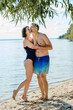 © Westend61 - A couple in love on vacation at the beach