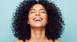 © Inspire Shots Hub - A smiling woman with curly dark hair and bright makeup, representing joy, happiness, and natural beauty, ideal for lifestyle or beauty concepts.