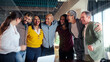 © CarlosBarquero - Professional team celebrating successful project milestone, sharing joyful moment of unity and laughing together in modern office workspace, highlighting collaborative workplace achievement