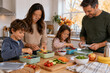 © DigitalDreamscape - Family preparing reusable lunch boxes together on an autumn morning