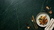 © Walid Forhad - Roasted vegetables served on a ceramic plate with cutlery and autumn leaves on a dark green marble surface vegetables seasonal vegetarian culinary delicious