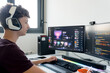 © ADDICTIVE STOCK - Young man use AI tools on gaming computer at desk
