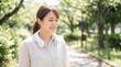 © Aliaksandra - Woman Wearing Portable Rechargeable Neck Fan Outdoors in Summer Park Cooling