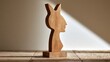 © spyrakot - Simplified female silhouette sculpture in thick freestanding wood on stone floor