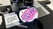 © Health Materials  - Close-up of a breast biopsy histology slide under a microscope 10x objective lens with H&E stain and red arrow