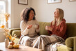 © Debi Kurnia Putra - Two Friends Laughing With Coffee at Home