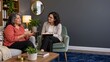 © OlgaNeuroArt - Mature woman talking to psychotherapist during counseling session. Female patient gesturing in therapy office. Mental health support and eating disorder treatment concept