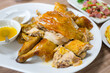 © leungchopan - Roasted chicken with crispy golden skin served on white plate
