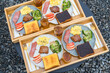 © leungchopan - Top down perspective of hearty breakfast sets arranged on wooden trays