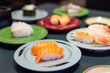 © leungchopan - Close up of various delicious sushi meal on dark table