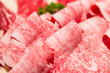 © leungchopan - Rolled slices of raw wagyu beef meat for hotpot taiwan