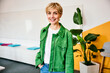 © BusinessClass by W61 - Smiling businesswoman stands in a modern office