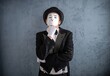 © Nomad_Soul - Thoughtful mime artist resting his chin on a gloved hand