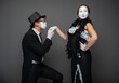 © Nomad_Soul - Male mime actor on one knee kissing his female partners hand