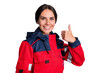 © deagreez - Photo of cheerful shiny young ambulance woman wear red jacket smiling showing thumb up isolated white color background