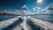 © Abba - Dynamic boat wake trails across deep blue sea under a bright sunny sky. Perfect for themes of travel, freedom, speed, and summer vacation.
