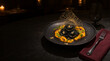 © ANDERLIO ART - Black Pasta Dish with Pumpkin Sauce and Gothic Halloween Decoration on a Dark Table / Plato de Pasta Negra con Salsa de Calabazas y Decoración Gótica de Halloween en Mesa Oscura