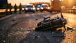 © Aldy - Motorcycle accident aftermath on a busy highway at dusk, with the damaged vehicle lying amidst debris and emergency services responding to the serious road collision scene