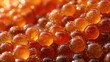 © swillklitch - Extreme macro close-up of glossy red orange salmon caviar fish roe with vivid spherical detail
