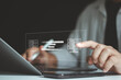 © MUNTHITA - Businessman hand using laptop computer with data host server storage icon for information exchange and transfer concept. FTP(File Transfer Protocol). Transfer data to a server or hosting service.