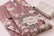 © y. - Neatly folded rose colored furisode kimono fabric with classical floral pattern and a plain obi on a soft pink background