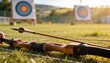 © Halim - Generative AI Archery practice outdoor targets on a grassy field showing a bow and arrow ready for