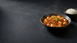 © phumin - A vibrant and flavorful bowl of spicy tofu and ground meat, garnished with fresh herbs, served alongside steamed white rice, presenting a classic Asian culinary experience