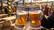 © Vera - Oktoberfest beer stein with blue white pattern clinking in celebration