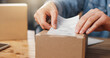 © peopleimages.com - Person, hands or label with box for logistics, delivery instructions or shipping information in shop. Supplier, distributor or sticker with parcel or package for courier service in online store