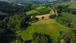 © Seleznov_Molchanova - Aerial view of scenic green rolling hills and vineyards in Southern Carinthia near Slovenian border. Small traditional farmhouses sit among agricultural fields in summer sunshine.