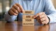 © Png Stock - Hands holding wooden blocks with the question what are your obligations