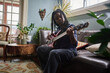 © Gabi Bucataru/Stocksy - Bass guitar practice