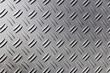 © beautiful-photo.de - Silver diamond plate metal texture background. Industrial anti slip metallic surface with checkered pattern, steel floor or step texture in bright sunlight close up.