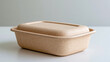 © Nataliya - Rectangular biodegradable food container made from natural fibers, eco-friendly packaging concept, clean studio product photography, minimalist neutral background, sustainable