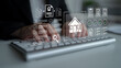 © InfiniteFlow - A focused business professional interacts with a keyboard, showcasing a seamless blend of digital icons and documents representing real estate and efficient workflow management. Gantry